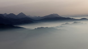 black mountains surrounded by white fogs, landscape, mist, mountains, sunrise