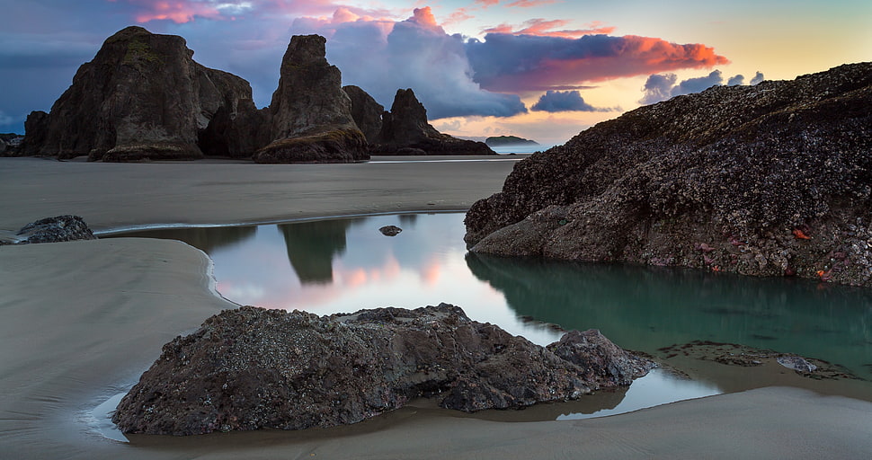 rock monolith, water, reflection, sunset, clouds HD wallpaper