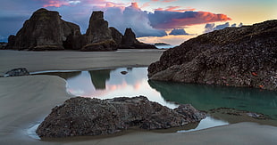 rock monolith, water, reflection, sunset, clouds HD wallpaper