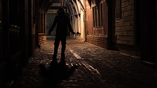 silhouette of person standing on street