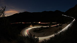 lighted winding road, highway, long exposure, hairpin turns, landscape