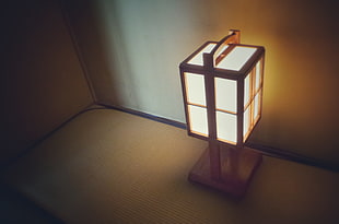 gray and white table lamp against wall