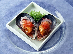 cooked seafood on white ceramic saucer