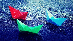 three blue, red, and green paper boats, paper, water