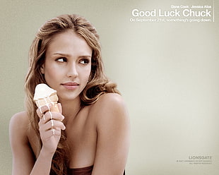 brown haired woman holding ice cream advertisement
