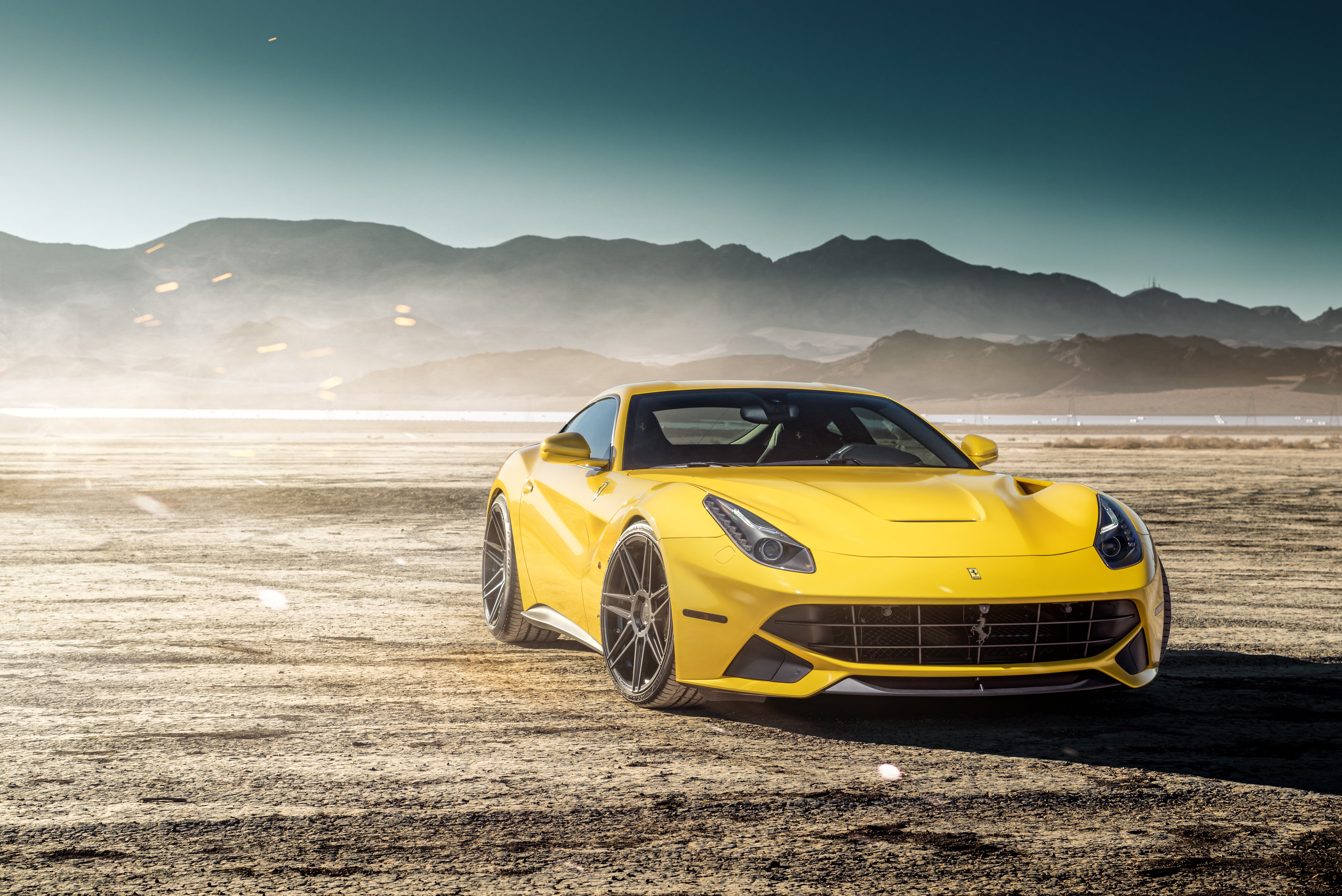 yellow Ferrari sport car