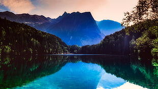 mountain range photography by the water
