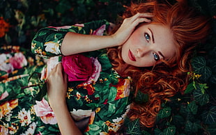red haired woman in green floral dress