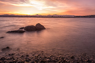 Rocky shore during sunset HD wallpaper