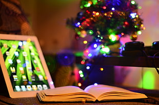 blue and green string lights, iPad, Christmas, christmas lights, books