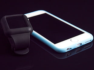 black smartwatch and silver iPhone 5