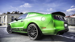 green Ford Cobra Shelby coupe on gray concrete road HD wallpaper