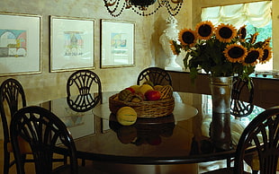 fruits filled basket on top of dining table