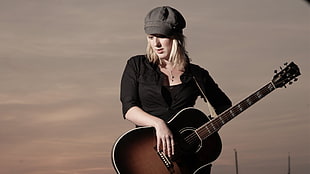 woman holding sunburst acoustic guitar HD wallpaper