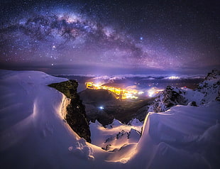 galaxy under snow covered mountain