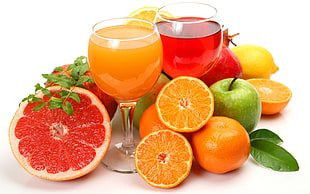 fruits and champagne glass filled with juice photo