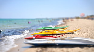 four assorted-color kayaks, beach HD wallpaper