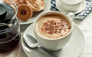 cappuccino in white ceramic coffee mug on white ceramic saucer during daytime HD wallpaper