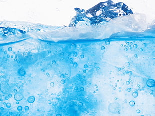 photo of ice in blue liquid