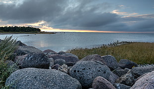 landscape photography of gray rock field on seaside under cloudy sky during daytime, Öland