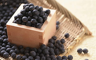 black berries on a brown wooden box