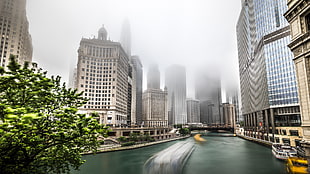 panorama timelapse photography of boats crossing river and high rise building range view, chicago