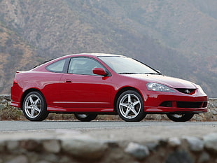 photo of red Hyundai coupe near mountain
