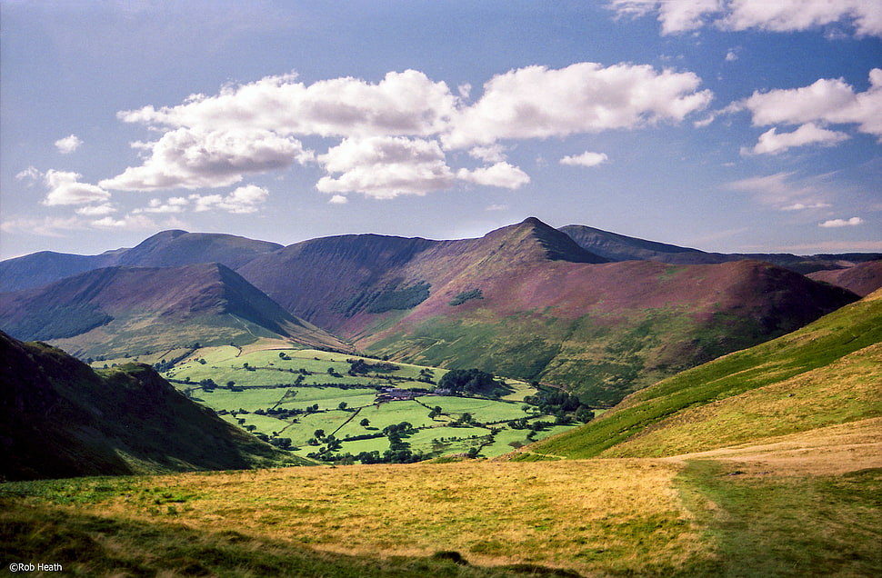 landscape photo of green and brown hills during daytime HD wallpaper