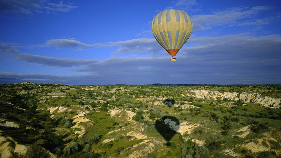gray hot air balloon flying during daytime HD wallpaper