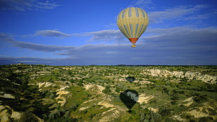 gray hot air balloon flying during daytime HD wallpaper