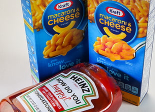 Heinz tomato ketchup bottle beside two cheese labeled boxes