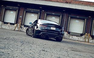 black Audi coupe on road