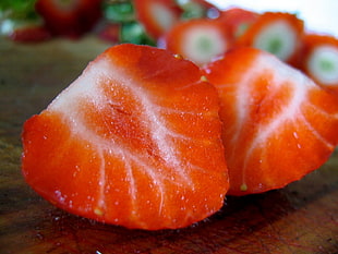 close up photography of sliced strawberry