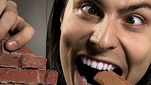 person eating concrete bricks