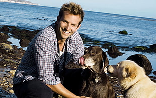 man with two dogs photo