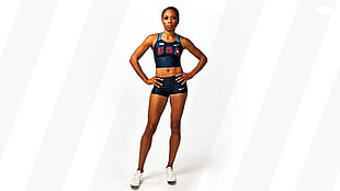 standing woman with blue Nike sports bra and shorts