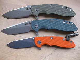 three assorted-color folding knives, xm-18, Hinderer, knife