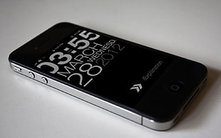 black iPhone 4 in white table HD wallpaper