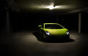 low light photography of green sports car