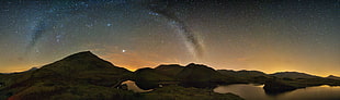 silhouette of mountain under starry sky HD wallpaper