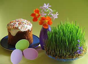 caramel cake beside a flower centerpiece