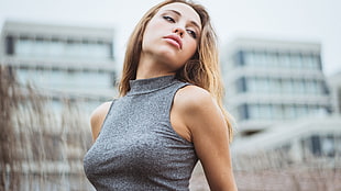 woman wearing gray halter-neck sleeveless top
