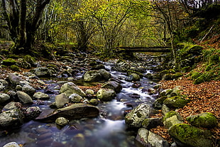 time lapse photography of river surrounded by stones HD wallpaper