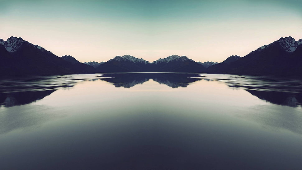 landscape photography of reflection of mountains on body of water HD wallpaper