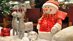 snowman figurine with two grey deer  figurines