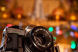 selective focus photography of black AE-1 camera with background of boke light HD wallpaper