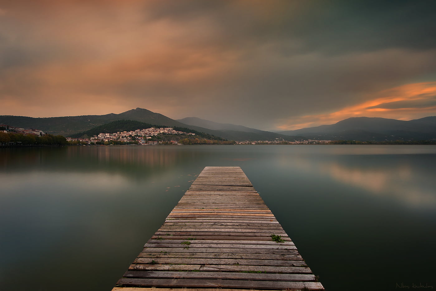 brown wooden dock bridge on lake
