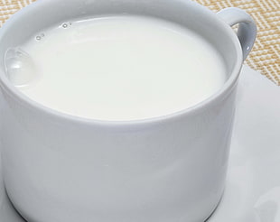 white ceramic mug with milk