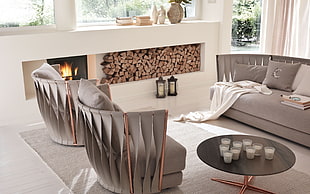 gray living room set with fireplace inside the house