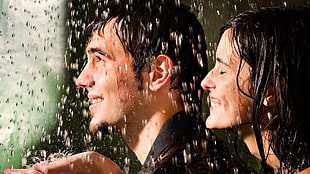 couple smiling while raining